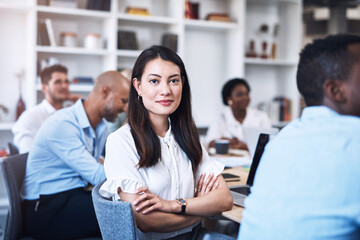 Fototapeta premium Businesswoman, portrait or arms crossed in meeting for confidence, teamwork or collaboration in office. Planning, empower and proud worker for feedback, paperwork and startup project for development