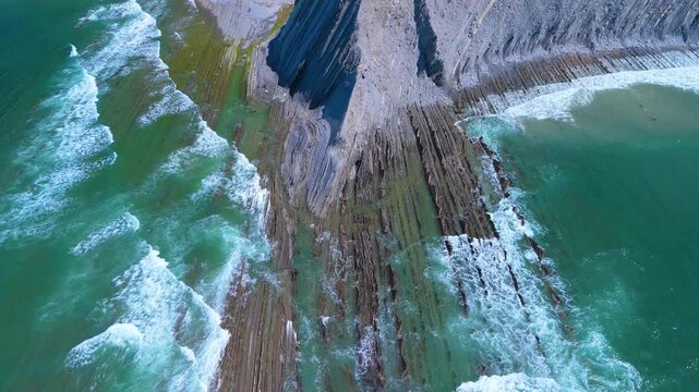 Rising tide on the Sakoneta Flysch. Aerial view from a drone on the Cantabrian Coast in Deva. Cantabrian Sea. Gipuzkoa Province. Basque Country. Spain. Europe
