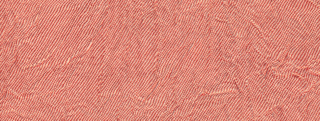 Coral and peach wavy background from textile material. Texture of rose fabric with wrinkled pattern