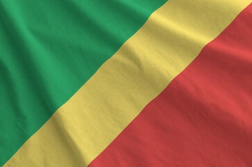 Congo flag depicted on folded wavy fabric of old cloth close up