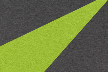 Texture of old craft black and green color paper background, macro. Vintage abstract cardboard