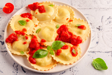 Ravioli with tomato sauce and basil
