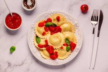 Ravioli with tomato sauce and basil