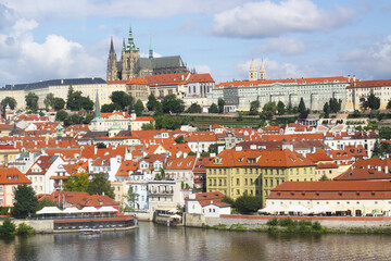 Prague castle from a distance, overlooking the Vltava or Moldau river. Prague, Czech Republic. Prague Old Town skyline