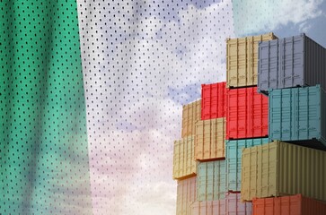 Nigeria flag and big stack of shipping cargo containers in docks with sky background close up