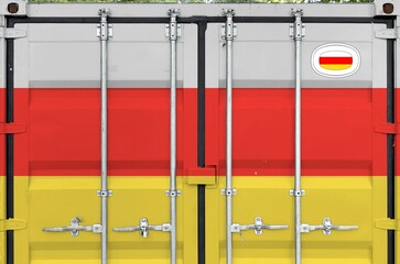 South Ossetia flag depicted on metal doors of shipping cargo container outdoors in docks area close...