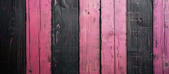 A black backdrop featuring a pink striped wooden pattern providing a serene copy space image