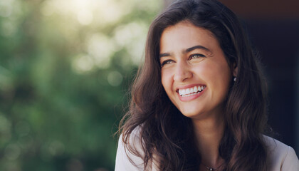 Happy, woman and face in nature for thinking, positive mindset and carefree with mockup space. Female person, smile and inspiration in natural environment for wellness, peace and relaxing in Portugal