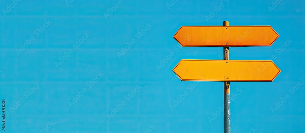 Poster close up comparison background featuring two blank signs on a blue backdrop providing copy space for