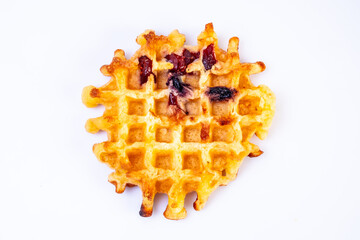 Homemade waffles. Soft waffles with died fruits on a white background.