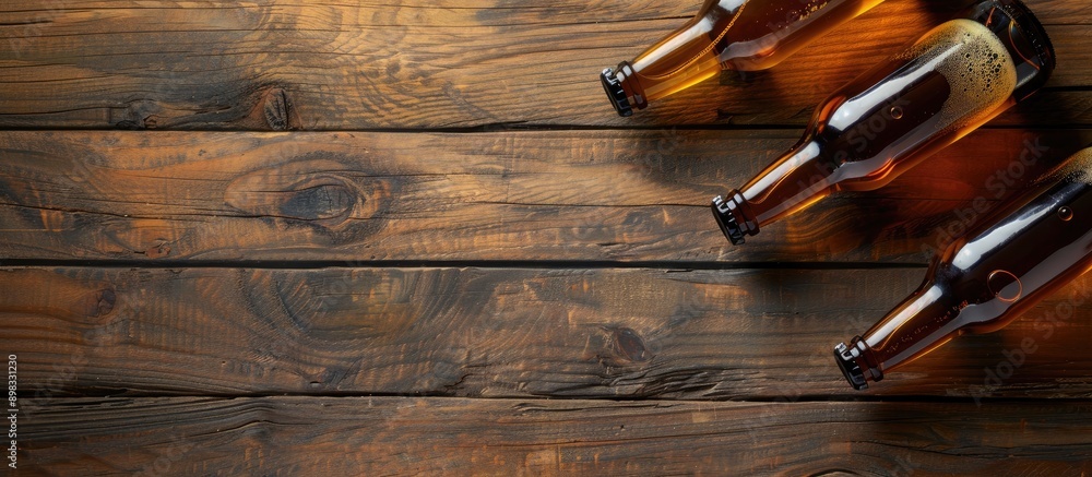 Poster Top view of beer bottles on a wooden table with selective focus creating a mock up with copy space for images a blank template is available