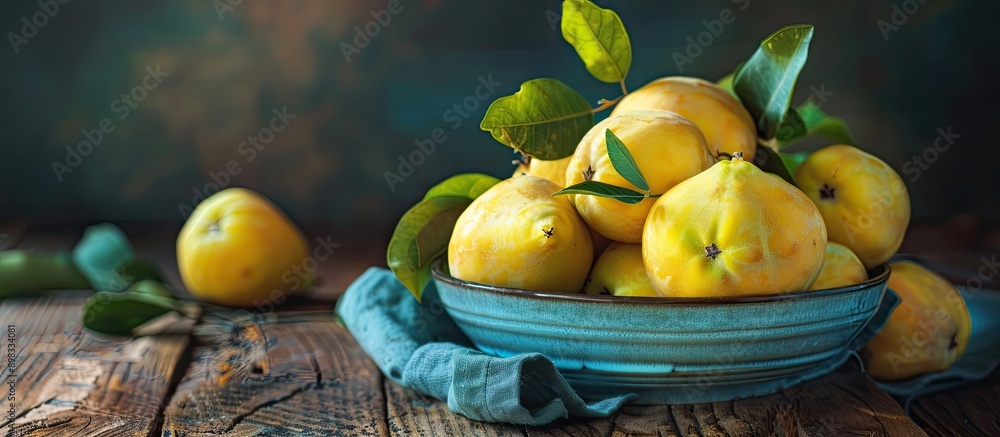 Canvas Prints close up of delicious ripe quinces in a bowl on a wooden table with copy space image available
