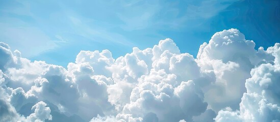 Blue sky with fluffy clouds offering a serene backdrop for copy space image