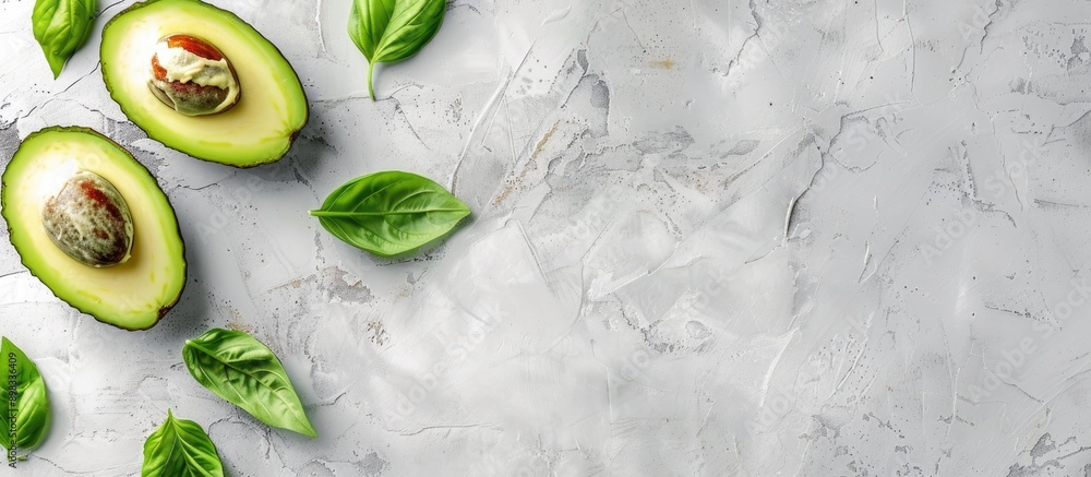 Poster Avocado placed on a white wooden table with a blank space for an image. Creative banner. Copyspace image