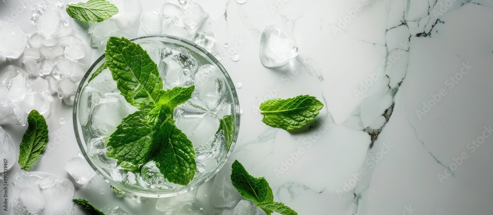 Poster closeup of a tantalizing mint liqueur with ice and green leaves on a white marble surface ideal for 