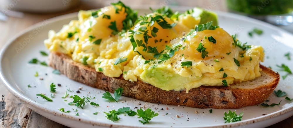 Poster a delectable breakfast choice showcasing toast topped with creamy avocado gooey melted cheese and fl
