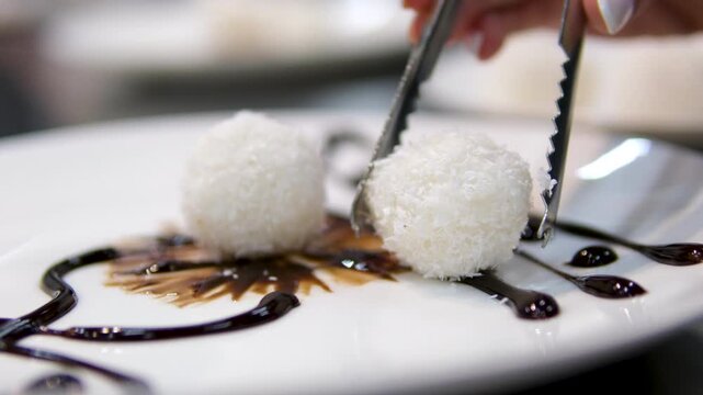 Cooking coconut balls Close up chef hands cooking Coconut Balls or Ka Nom Tom, Thai Traditional Dessert