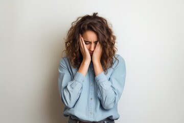 Stressed woman with curly hair