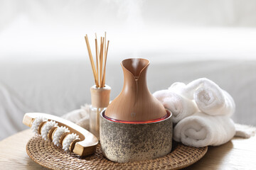Essential oil aroma diffuser humidifier diffusing water articles in the air.