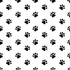 Animal footprints pattern. Seamless pattern with the image of black paws on a white background. Paws of cats and dogs. Pattern for print and gift wrapping.