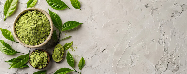 Obraz premium Mockup of matcha tea powder with leaves on a light gray background, offering a neutral and modern backdrop with room for text or graphics.