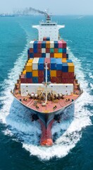 Aerial front view of cargo maritime ship with contrail in the ocean ship carrying container and...