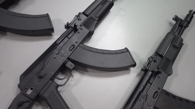 Machine guns and machine guns at a military weapons show. Black modern machine guns for the army and police. Arms trade concept.