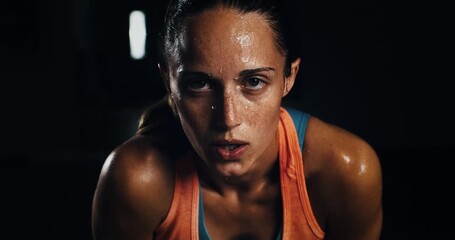 Super slow motion close up of sweat female athlete is relaxing and breathing on a break from doing workout to maintain healthy lifestyle and bodybuilding fitness goals in a gym at 1000 fps. - Powered by Adobe
