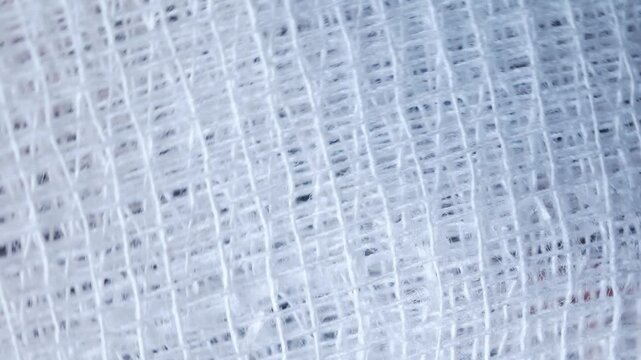 Close-up of white medical bandage Details and textures woven pattern background, Macro photo details of bandage weaving fibers, wallpapers