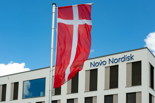 Novo Nordisk advertising flags and logo on facade building, Danish pharmaceutical healthcare giant, production innovative drugs, Ozempic, Mainz, Germany &ndash; June 15, 2024