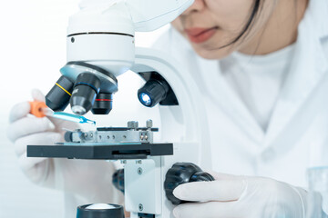 Scientist analyze biochemical samples in advanced scientific laboratory. Medical professional use...