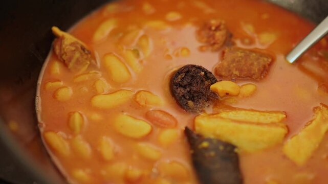 fabada asturiana. asturian beans with chorizo, black pudding and bacon. traditional food from the north of spain.