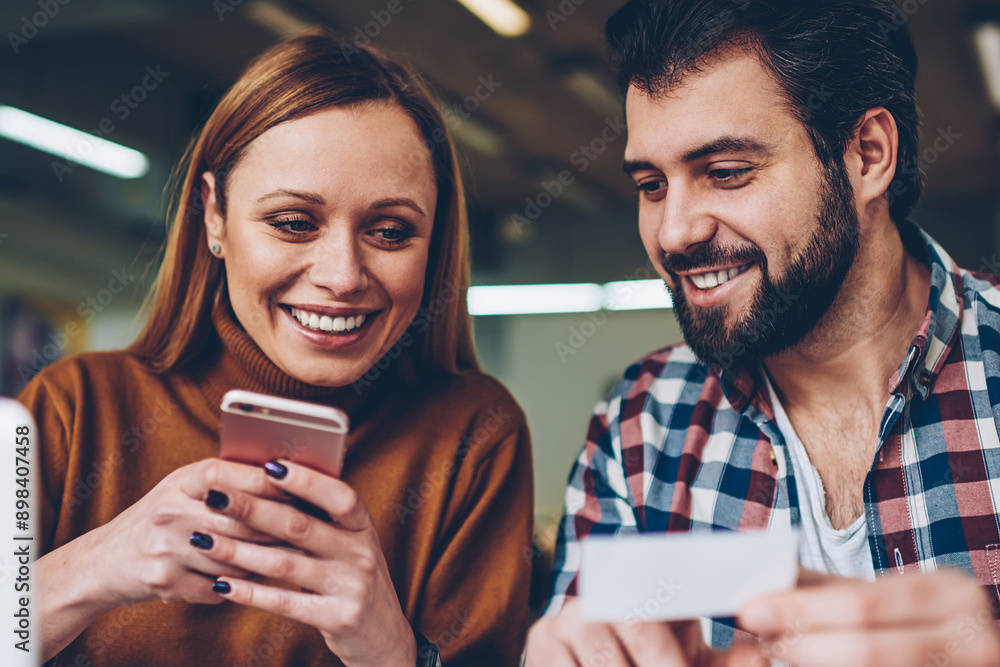 Poster attractive smiling hipster girl typing funny joke from paper gived positive male friend in social ne
