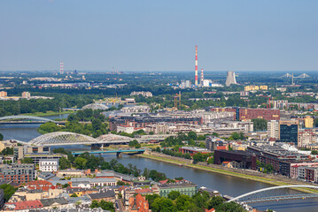 Bridges leading from Old town of Krakow through Vistula river to Podgorze district and PGE Power Station on the background. View from observation viewing platform on tethered balloon Balon Widokowy  © Blumesser