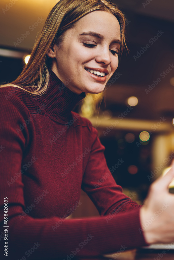 Poster happy hipster girl sharing media files via touch pad and laptop device using bluetooth connection in