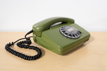 Old green Rotary Telephone with Disc Dial, Dialing on retro phone reciver down, Connecting with...