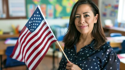 Proud hispanic teacher holds american flag in classroom, symbolizing patriotism and education during back-to-school season