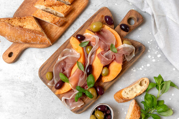 Italian prosciutto Parma ham with melon and olives traditional Italian antipasto