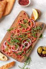 Tomatoes salad  with pesto sauce and arugula summer healthy eating salad