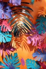 Fototapeta premium Tropical leaves, paper cut out multicolor paper cut out foliage background plant against orange color with copy space