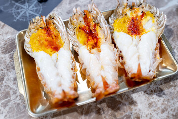 Grilled giant river shrimp or prawn, Popular Thai sea food, The shrimp head will be in creamy orange color with an extremely good taste.