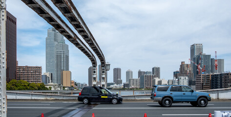 Tokyo city skyscrapers against blue sky, Japan