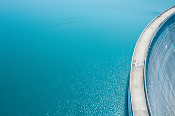 Closeup of lake water dam wall structure, representing industrial reservoir and eco-friendly energy technology. Sustainable hydroelectric power solution for modern renewable energy
