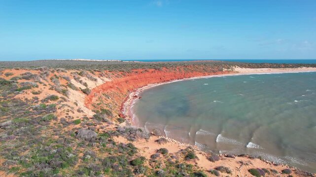 Aerial video of Cape Peron in Shark bay, Western Australia. Viewpoint from the platform orange land next to the beach and the ocean. Breathtaking view in the australian national park of Francois Peron