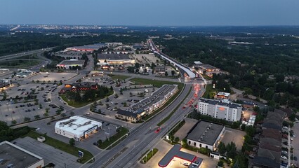 Aerial view of the cityscape of Waterloo at dusk with illuminated buildings and streets, Canada