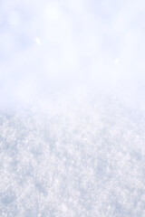 Snow texture with shadows winter background. Natural white snow crystals in winter. Snow powder. Vertical christmas background.