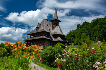 Barsana wooden church with romantic sky in Barsana, Maramures, Romania