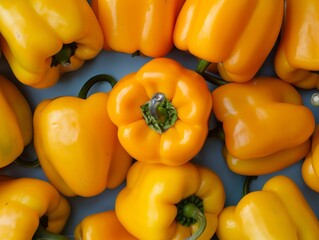 Aerial View of Vibrant Yellow Bell Peppers in Symmetrical Geometric Pattern &ndash; Soft Lighting and Detailed Textures