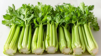 Obraz premium Crisp Celery Sticks on White Background for Healthy Eating Concept