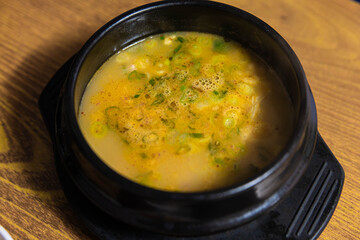 a hearty soup of piping hot pork rice porridge